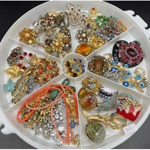 72 - Collection of vintage costume brooches and necklaces.