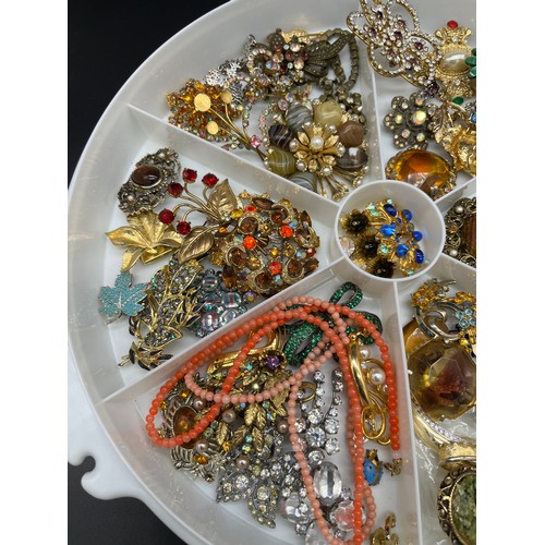 72 - Collection of vintage costume brooches and necklaces.