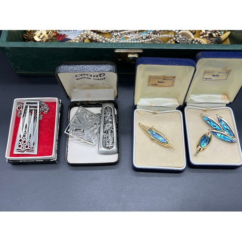 93 - Jewellery box containing a quantity of costume jewellery to include Celtic design pendants, brooches... 