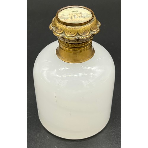 96 - 19th century white glass perfume bottle, designed with a gilt metal lid depicting a small picture of... 