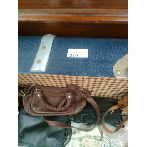 210 - Large Travel case containing large selection of linen and bags together with box of linen