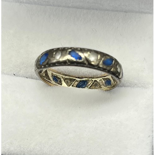 128 - Vintage 9ct white gold band ring set with rubbed/ worn white and blue stones. [Ring size Q] [2.78Gra... 