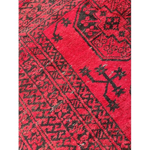 161 - Antique hand woven Indian/ Persian red and black ground rug. [193x120cm]