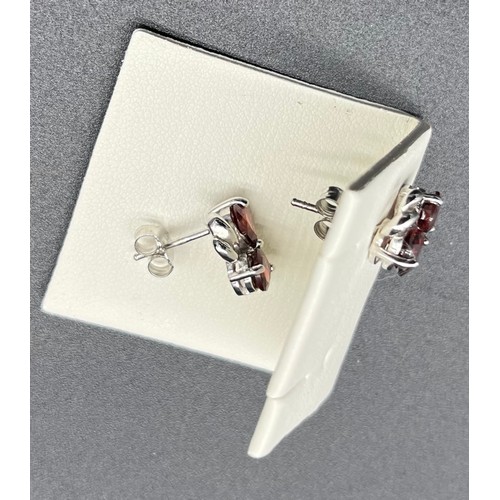 25A - A Pair of ladies Shipton & co 925 silver earrings set with garnet stones.