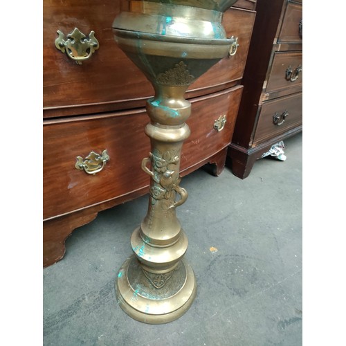 67A - Early brass oriental themed heavy jardiniere and stand .