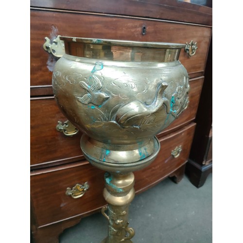 67A - Early brass oriental themed heavy jardiniere and stand .