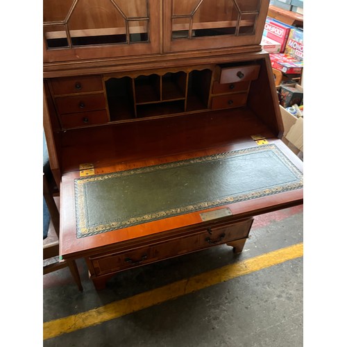 292A - Yew wood style bureau bookcase. Pull down writing area fitted with green leather and small stationar... 