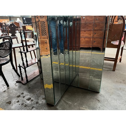 300A - Contemporary table, the octagonal glass top above a mirror X base table [Originally used in a design... 