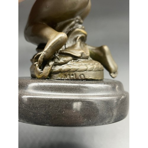 215 - Bronze nude lady sculpture sat upon a round marble base. Signed Milo. [26cm high]