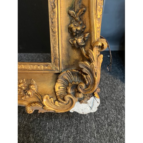 310 - Antique gilt frame with moulded scroll and foliate design [Frame 93x125cm]