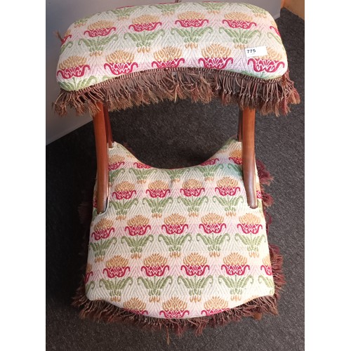 350 - 19th century prayer stool/ chair, upholstered in a floral material with brown fringe, raised on outs... 