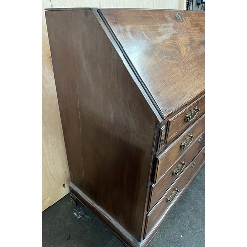 415 - Georgian writing bureau, the sloped top opening to a writing surface with storage compartments, abov... 