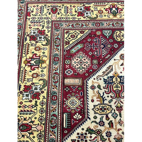 355 - Fine Persian carpet/rug, red and cream ground, highly decorative. [347x250cm]