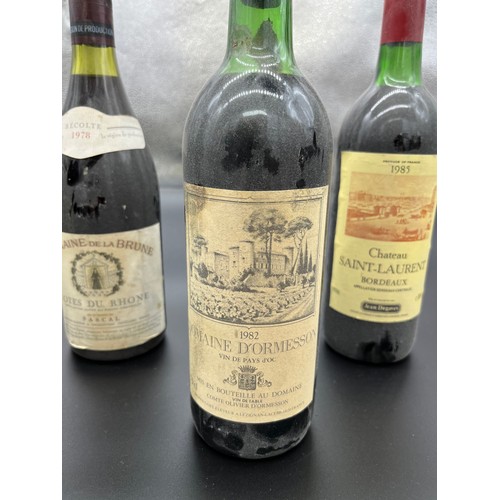 225 - Six Bottlings of Wine. Three bottles of 1985 Chateau Saint- Laurent Bordeaux, 1982 Domaine D' Ormess... 