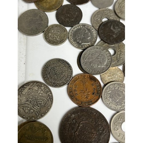 32 - A Collection of mixed world coins to include various silver coins.