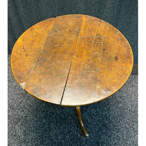 302 - 18th/19th century snap top table, the circular top raised on a tripod base [64cm high, 64cm in diame... 