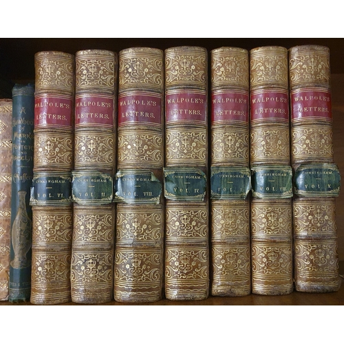 264 - A Collection of Books to include Ruskins works, 7 vols of Walpoles by cunningham, and Zeluco.