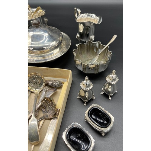 110 - A collection of silver plate and E.P Wares to included small lidded tureens, lion head sugar and cre... 