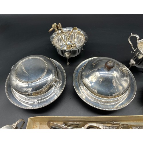 110 - A collection of silver plate and E.P Wares to included small lidded tureens, lion head sugar and cre... 