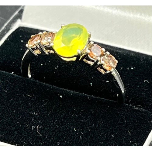 217 - 10ct white gold ladies ring set with a single yellow stone off set by smokey quartz stone shoulders ... 