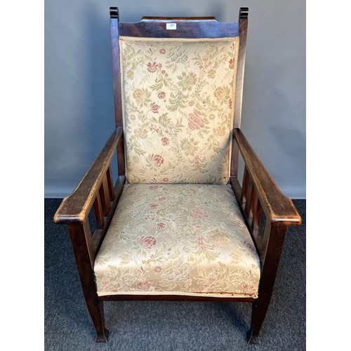 321 - Arts & Crafts oak Gentleman's armchair, the long-cushioned back above a cushioned seat raised on squ... 