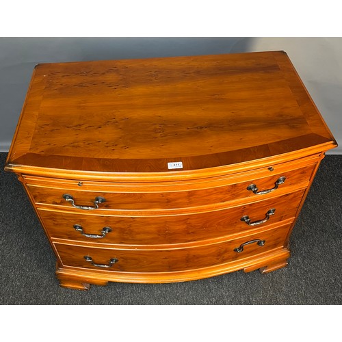 311 - 20th century yew wood chest of drawers, the rectangular top with bow front above a pull-out ledge an... 