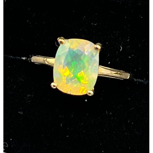 100 - 10ct yellow gold ladies ring set with a large opalescent style stone. [Ring size P] [1.98Grams]