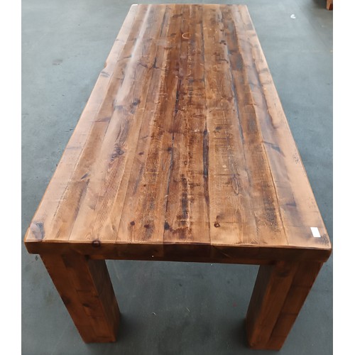 348 - Solid rustic wood dining table, the long rectangular surface raised on square block legs [80x244x97c... 