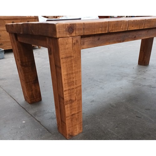 348 - Solid rustic wood dining table, the long rectangular surface raised on square block legs [80x244x97c... 