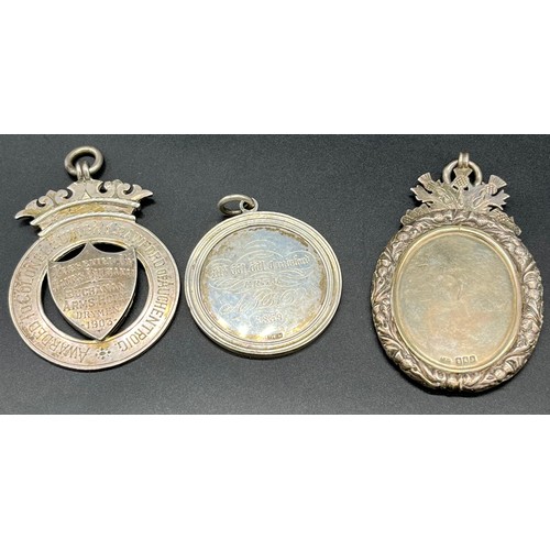 48 - Three antique silver medallion pendants. Two Glasgow silver hallmarked. 'Buchanan Arms Hotel'