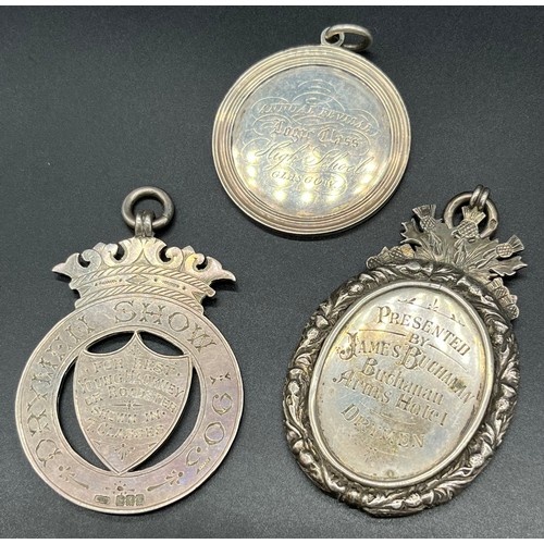 48 - Three antique silver medallion pendants. Two Glasgow silver hallmarked. 'Buchanan Arms Hotel'