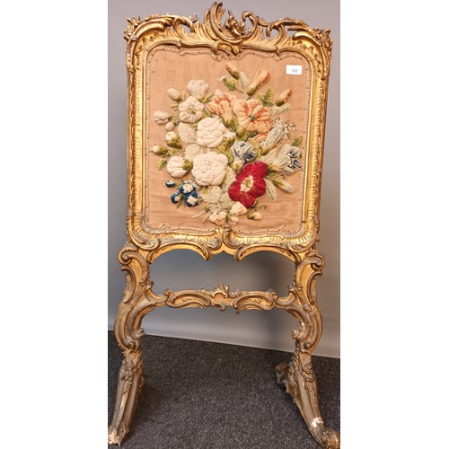 362 - Regency moulded gilt frame fire screen, fitted with floral embroidery, raised on trestle supports [1... 