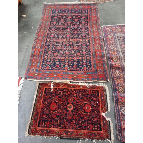 322 - A Collection of four Persian rugs [largest 194x 138] (Will Not Pack or Post)