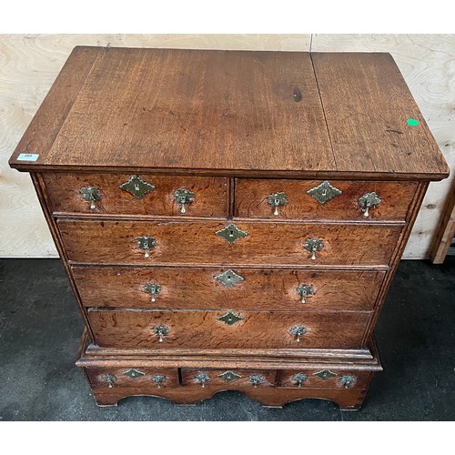 389 - Early 17th century chest on chest, the rectangular top above two short drawers and three graduating ... 