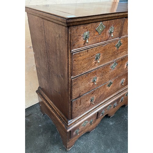 389 - Early 17th century chest on chest, the rectangular top above two short drawers and three graduating ... 