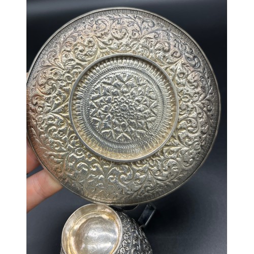 78 - Indian silver highly decorative cup and saucer. [Tested positive silver] [226.18grams]