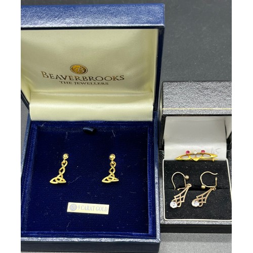 84 - A Pair of Beaverbrooks 9ct gold Celtic design earrings, together with a pair of 9ct gold earrings se... 