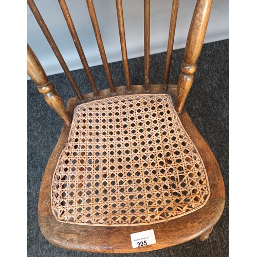 395 - Antique Childs spindle back chair with weaved seat and raised on turned legs