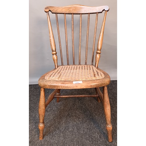 395 - Antique Childs spindle back chair with weaved seat and raised on turned legs