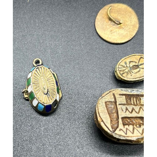 94 - A Collection of antique Egyptian revival jewellery. Includes 14ct gold and enamel pharaoh brooch, 80... 