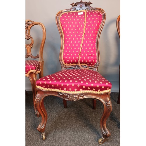 393 - Three Victorian bedroom chairs all with matching upholstery and raised on cabriole legs [98cm high]