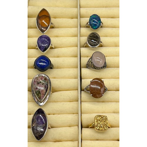 98 - A Lot of 10 silver and gem stone rings. The lot includes Lapis Lazuli, agate, amber and Amethyst