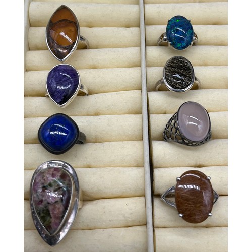 98 - A Lot of 10 silver and gem stone rings. The lot includes Lapis Lazuli, agate, amber and Amethyst