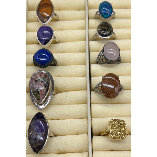 98 - A Lot of 10 silver and gem stone rings. The lot includes Lapis Lazuli, agate, amber and Amethyst