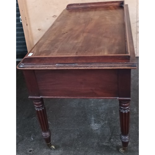 397 - 19th century desk, the gallery top above 
a writing surface and an arrangement of drawers, raised on... 