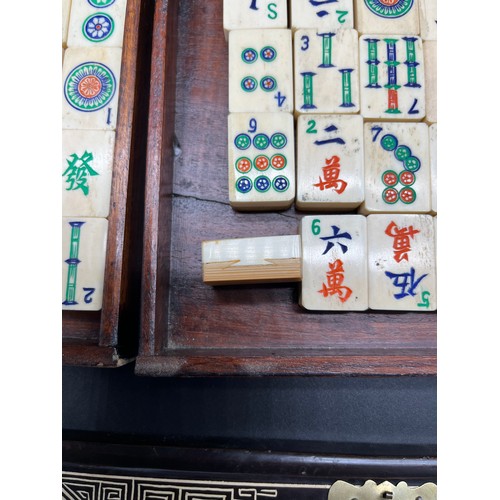 138 - Antique Chinese Mahjong game fitted within an ornate carry case, each panel depicting various figura... 