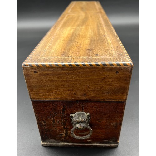 145 - 19th century mahogany box, designed with inlaid trims and brass lion head and hoop handles [12x58x11... 