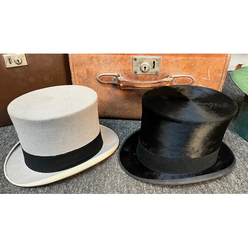 148 - Two Antique Gent's top hats. Both produced by Locke & Co Hatters London. Both come with carry cases.... 