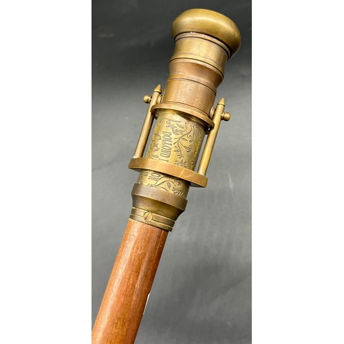 212 - Reproduction Dollond London walking cane fitted with a brass handle, fitted with a compass and swive... 