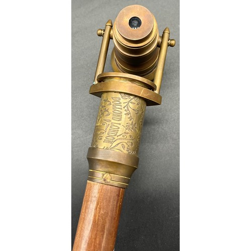 212 - Reproduction Dollond London walking cane fitted with a brass handle, fitted with a compass and swive... 